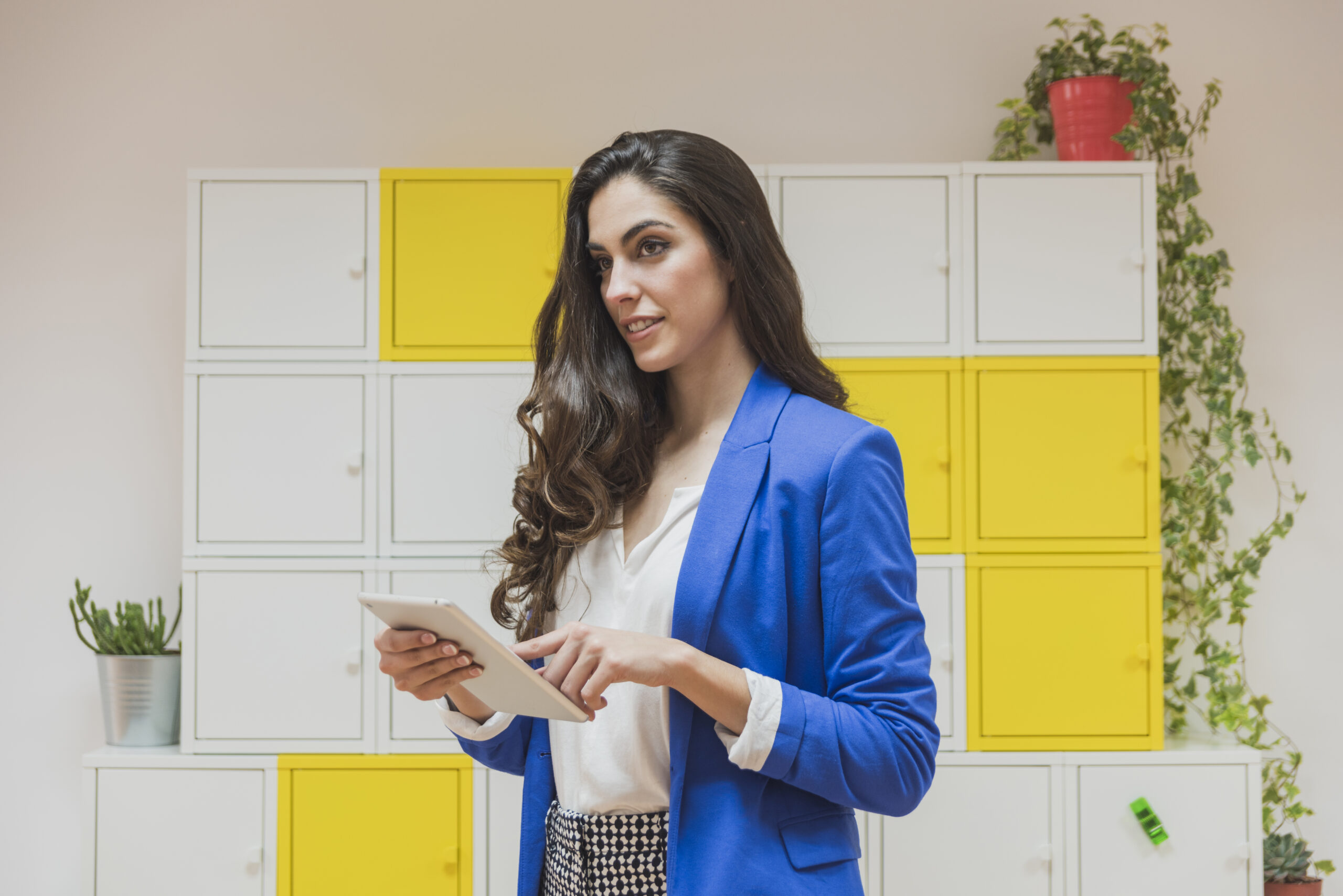 pretty businesswoman holding tablet office